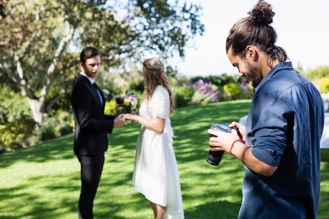 photographer-reviewing-photographs-on-digital-camera